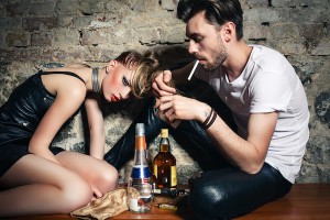 The couple with ciggarettes and alcohol